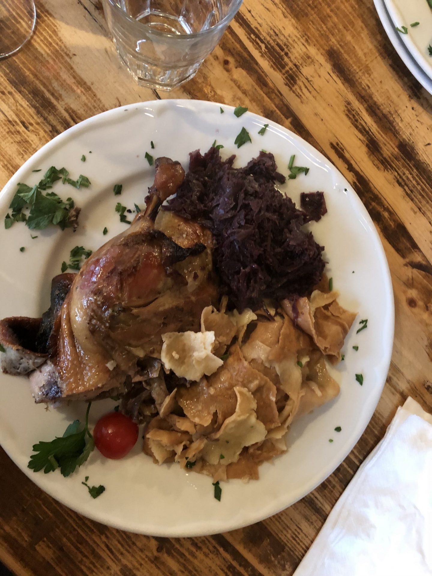 plate of meat, cabbage, and mlinci