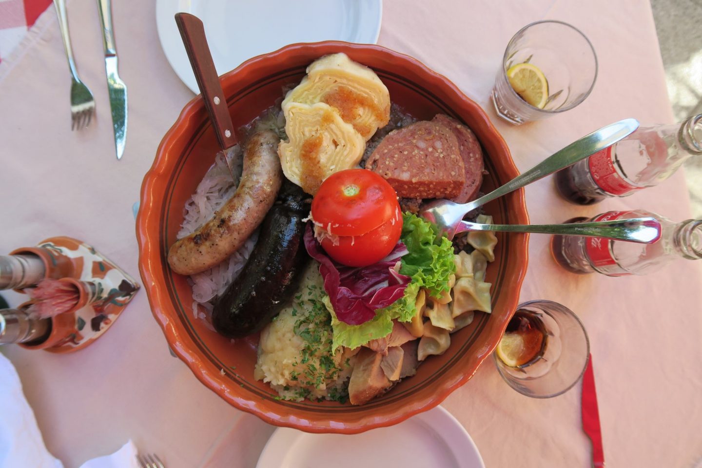 A large bowl full of traditional Slovenian food.