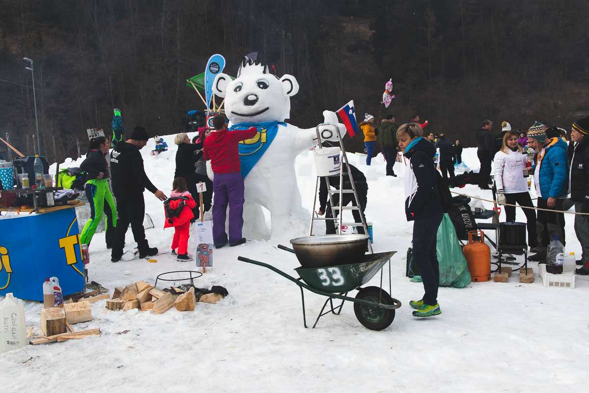 people building a snow bear