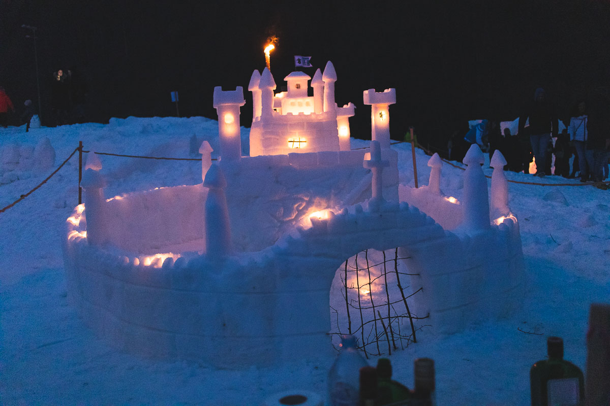 snow castle lit up with candles