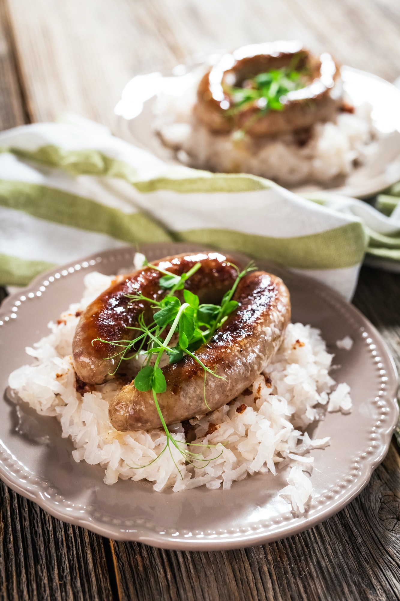 Sausage and sour turnips on rustic background